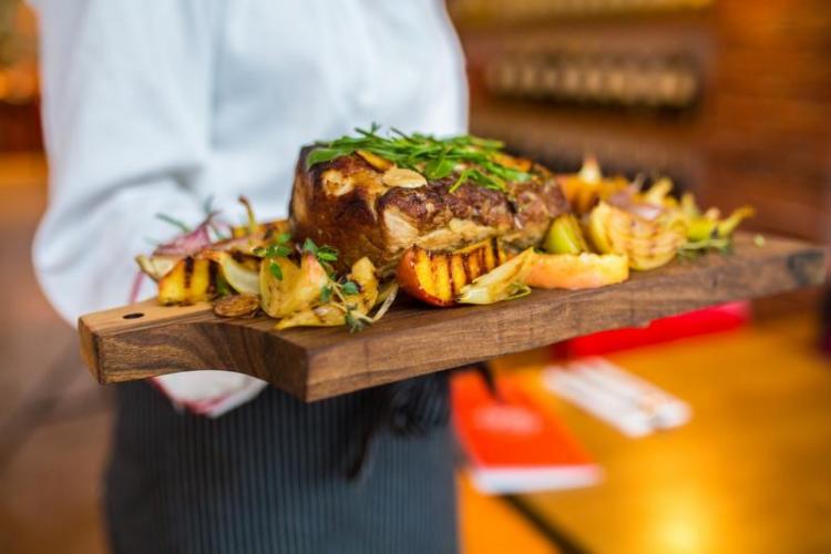 Steak on wooden serving platter